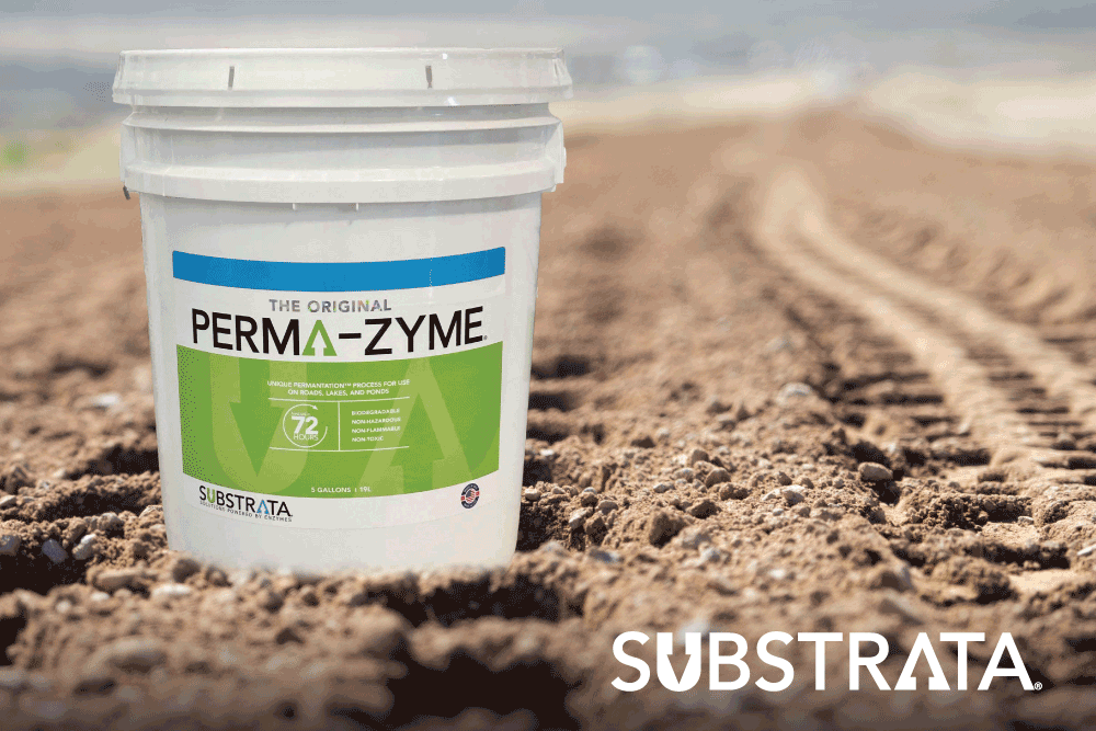 Perma-Zyme pail on dirt road