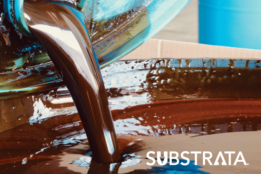 Pouring Perma-Zyme into a large container