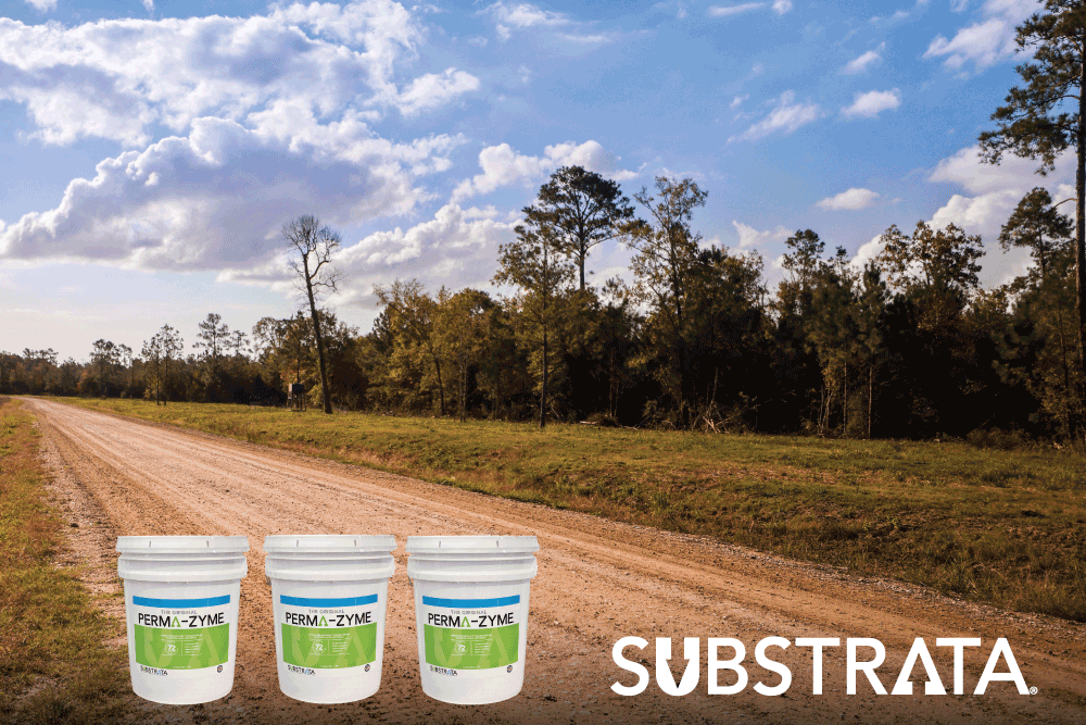 Three pails of Perma-Zyme on an unpaved, treated road in Texas