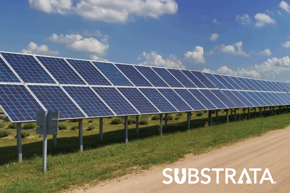 Solar panels alongside an unpaved road