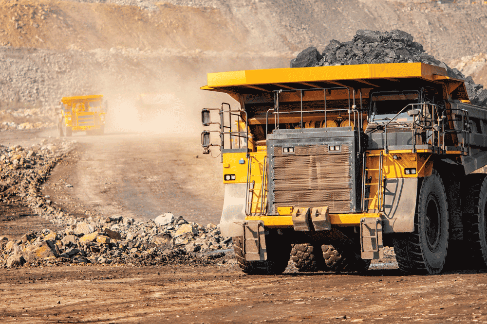 Articulated haul truck carrying material out of a surface mine pit