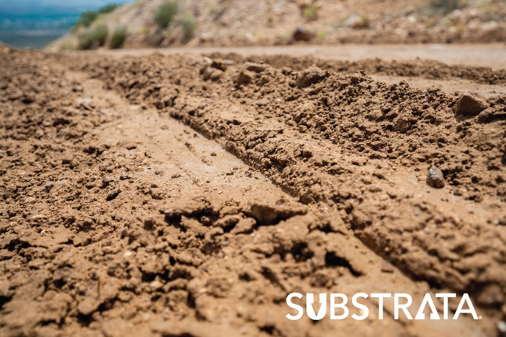 Close-up of moist, compacted soil