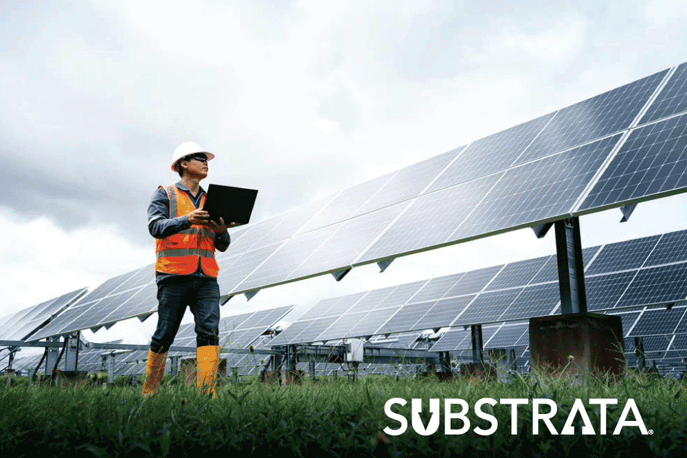 Solar farm maintenance worker checking panels