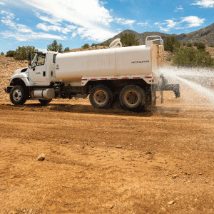 Water truck applying Perma-Zyme soil stabilizer