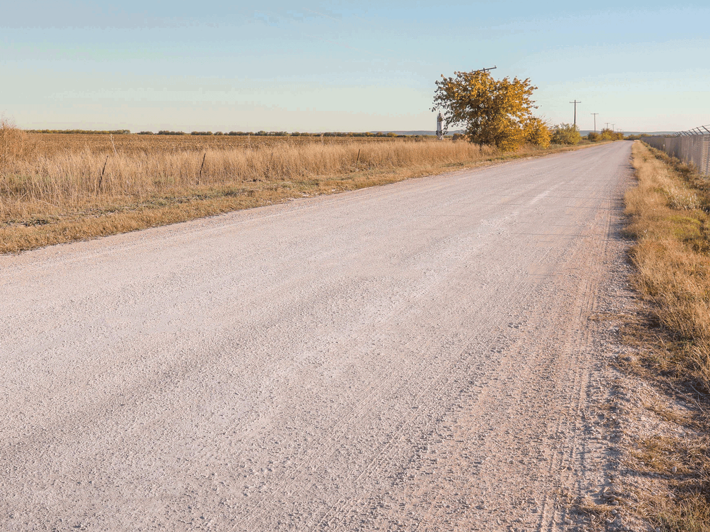 Side view showing completed stretch of Abilene road treated with Perma-Zyme