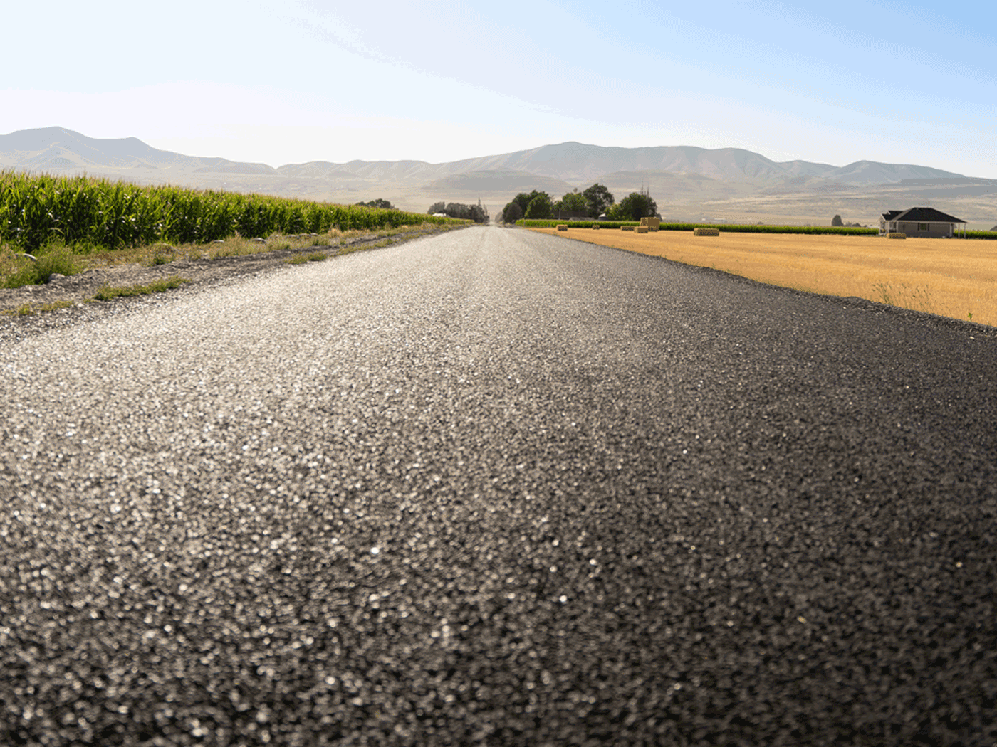 Straight-on view of completed Perma-Zyme stabilized road with chipseal in Box Elder County