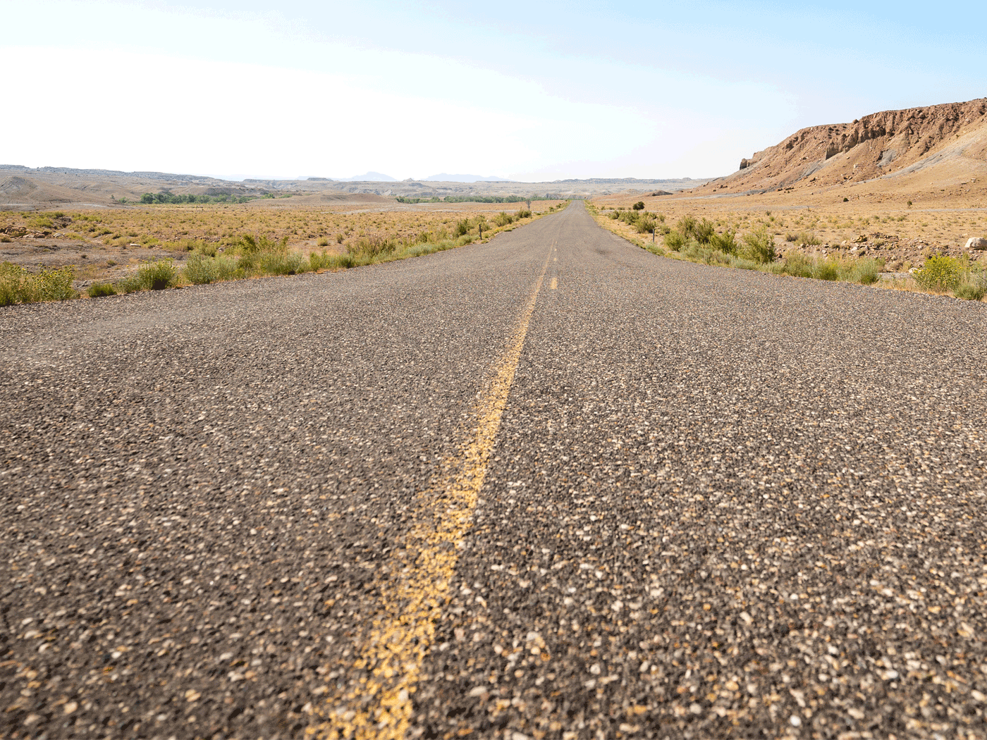 Straight on view of Perma-Zyme stabilized road with chipseal topcoat in Emery County from 2020