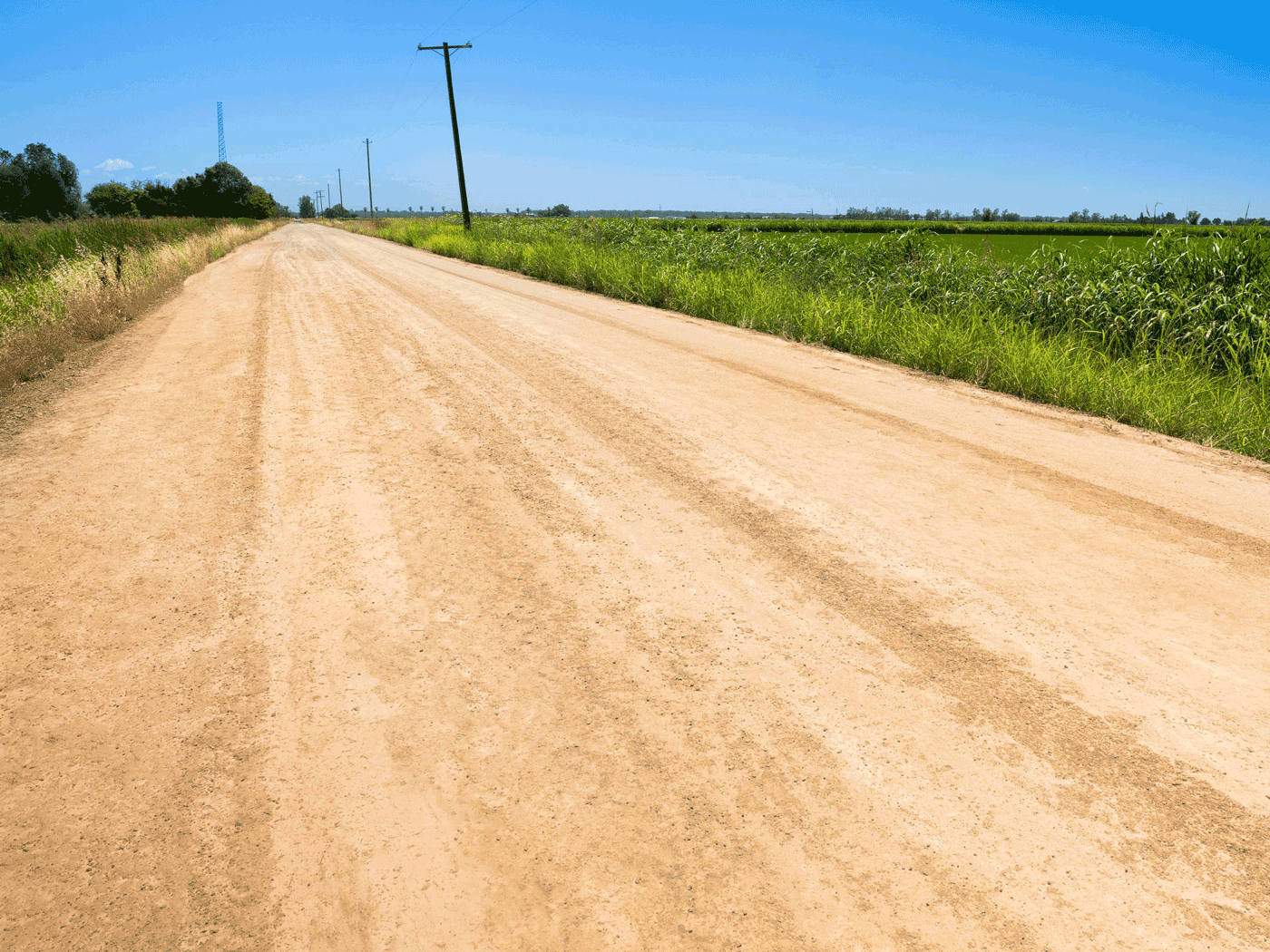 Straight view of completed Perma-Zyme stabilized road in Glenn County