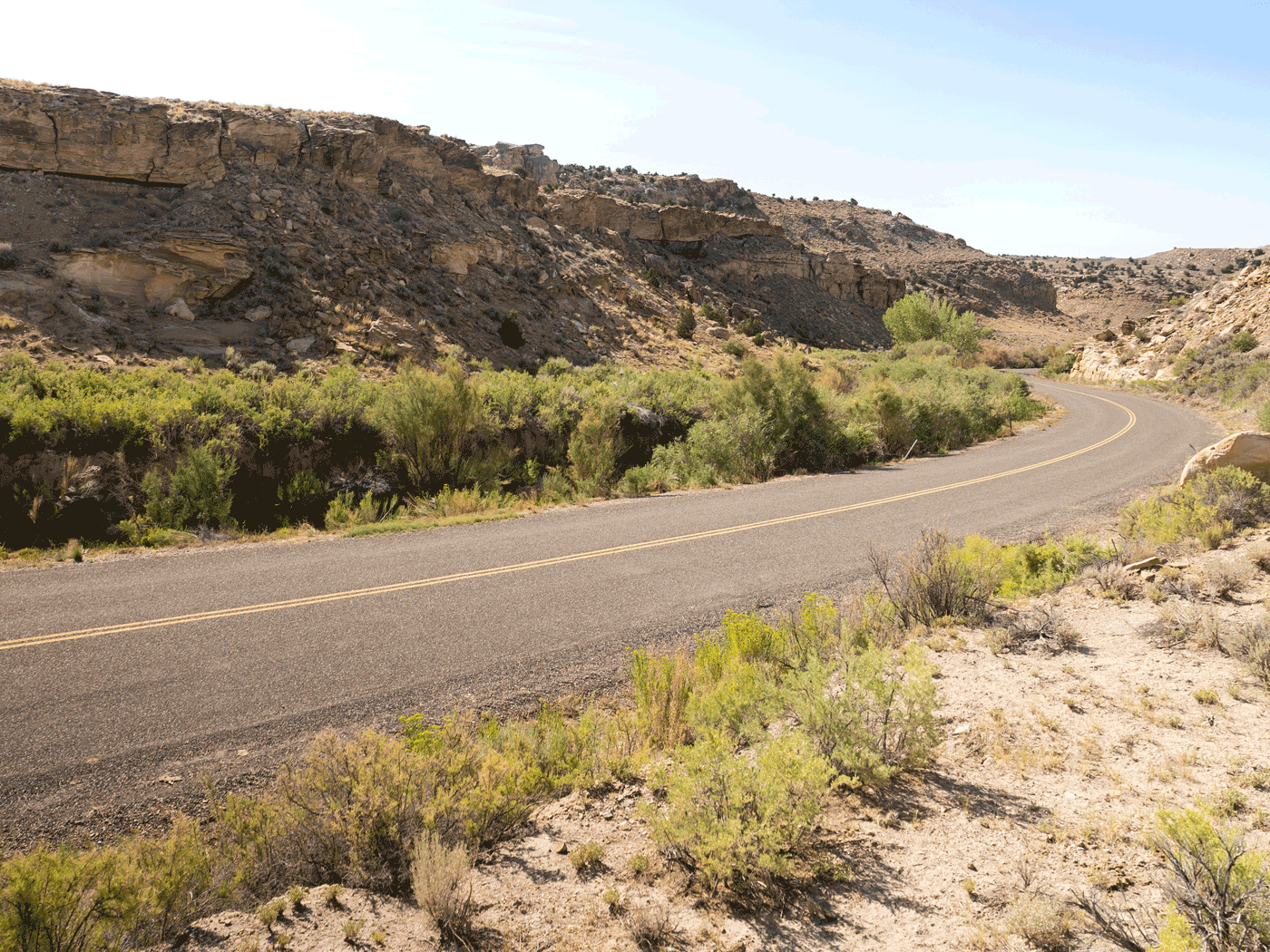 Side view of Emery County road showing road condition of chipseal over Perma-Zyme stabilized subbase