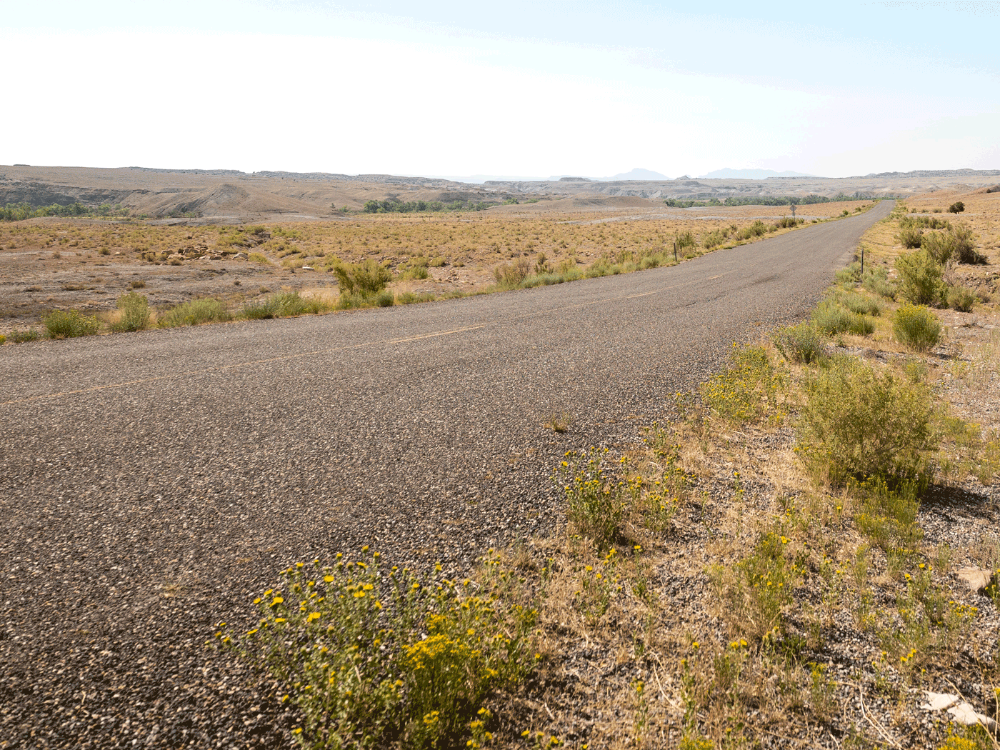 Alternate side view of Emery County road showing road condition of chipseal over Perma-Zyme stabilized subbase