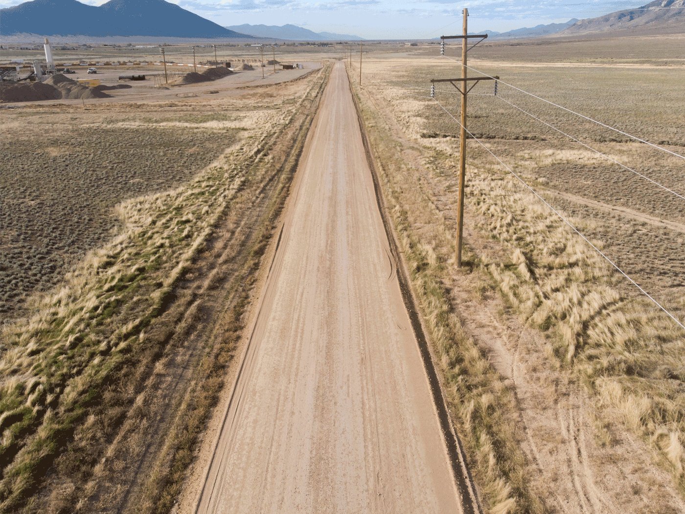 Aerial view showing completed stretch of White Pine County road treated with Perma-Zyme