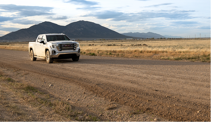 Truck Driving Down Road